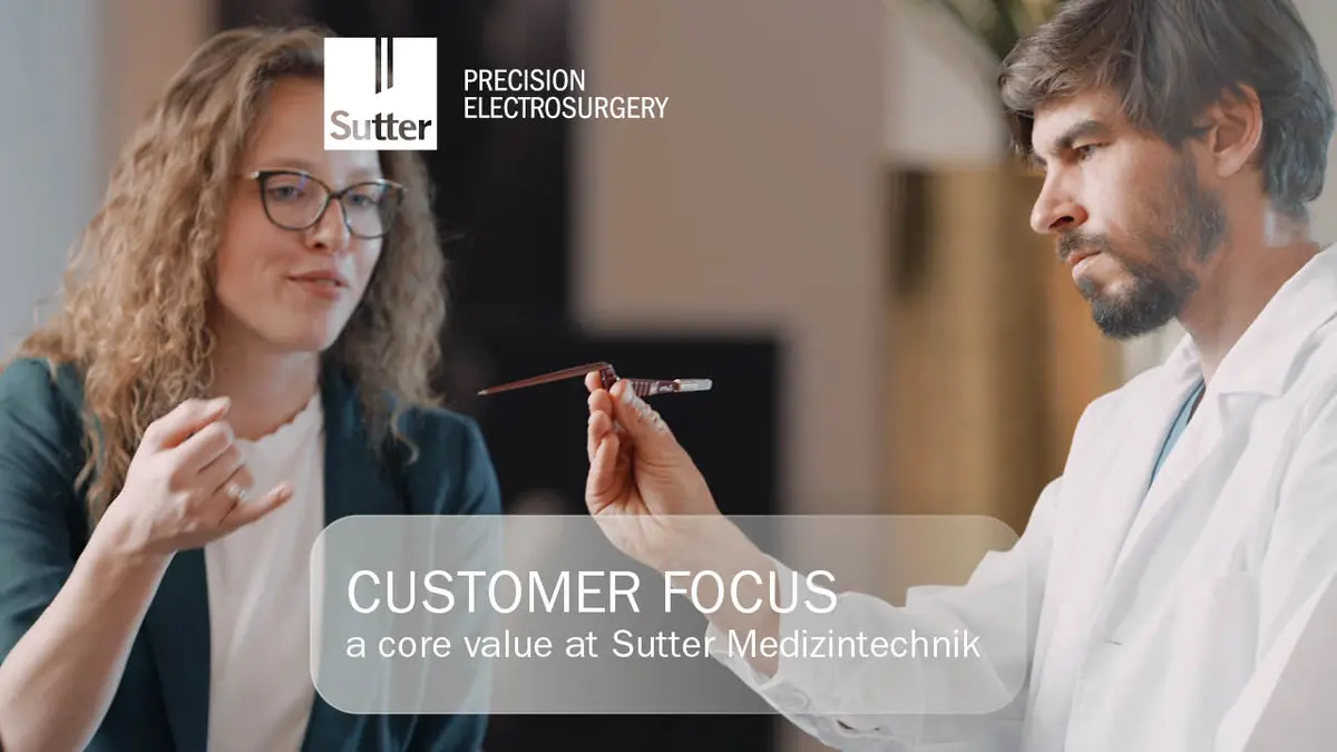 Two people in discussion, focus on precision instrument, Customer Focus at Sutter Medizintechnik